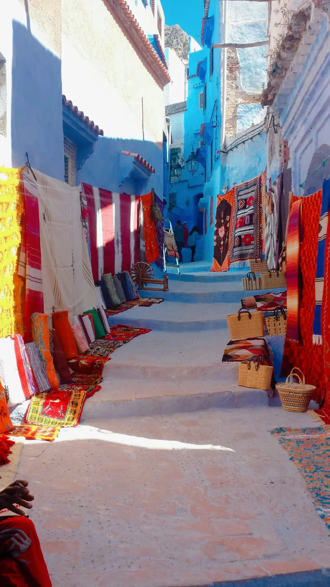 Traveler shopping for lanterns in a Marrakesh souk, Morocco