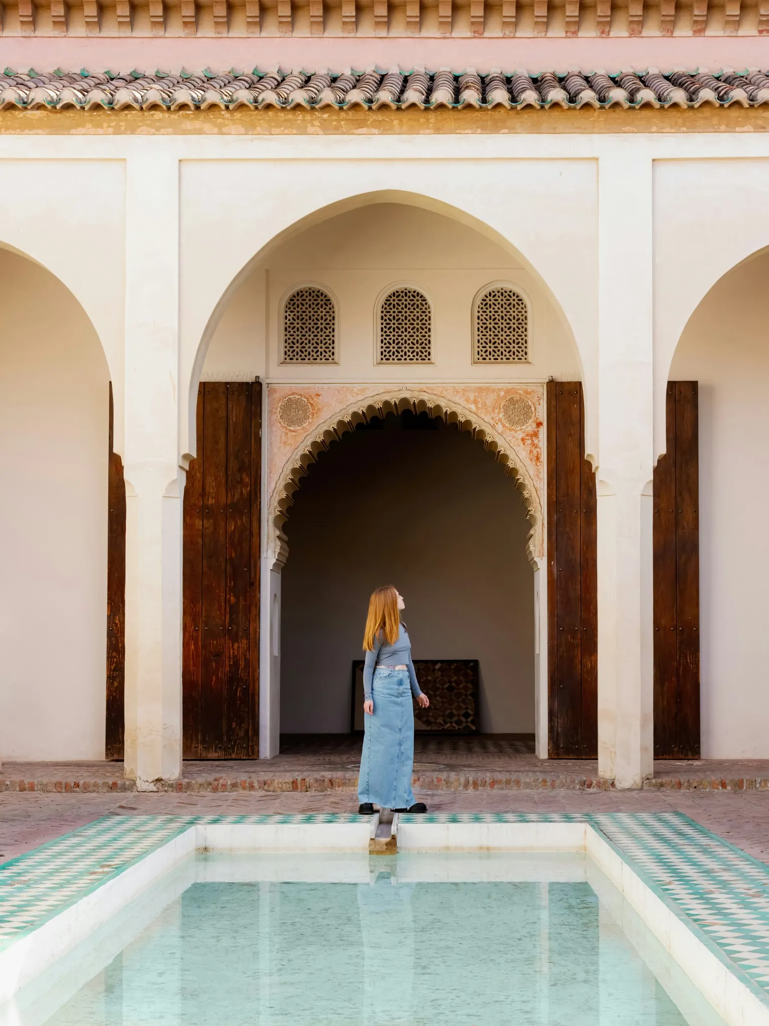 Artisan crafting traditional hand-painted ceramics during a culture stop on an Imperial Cities Tour Morocco.