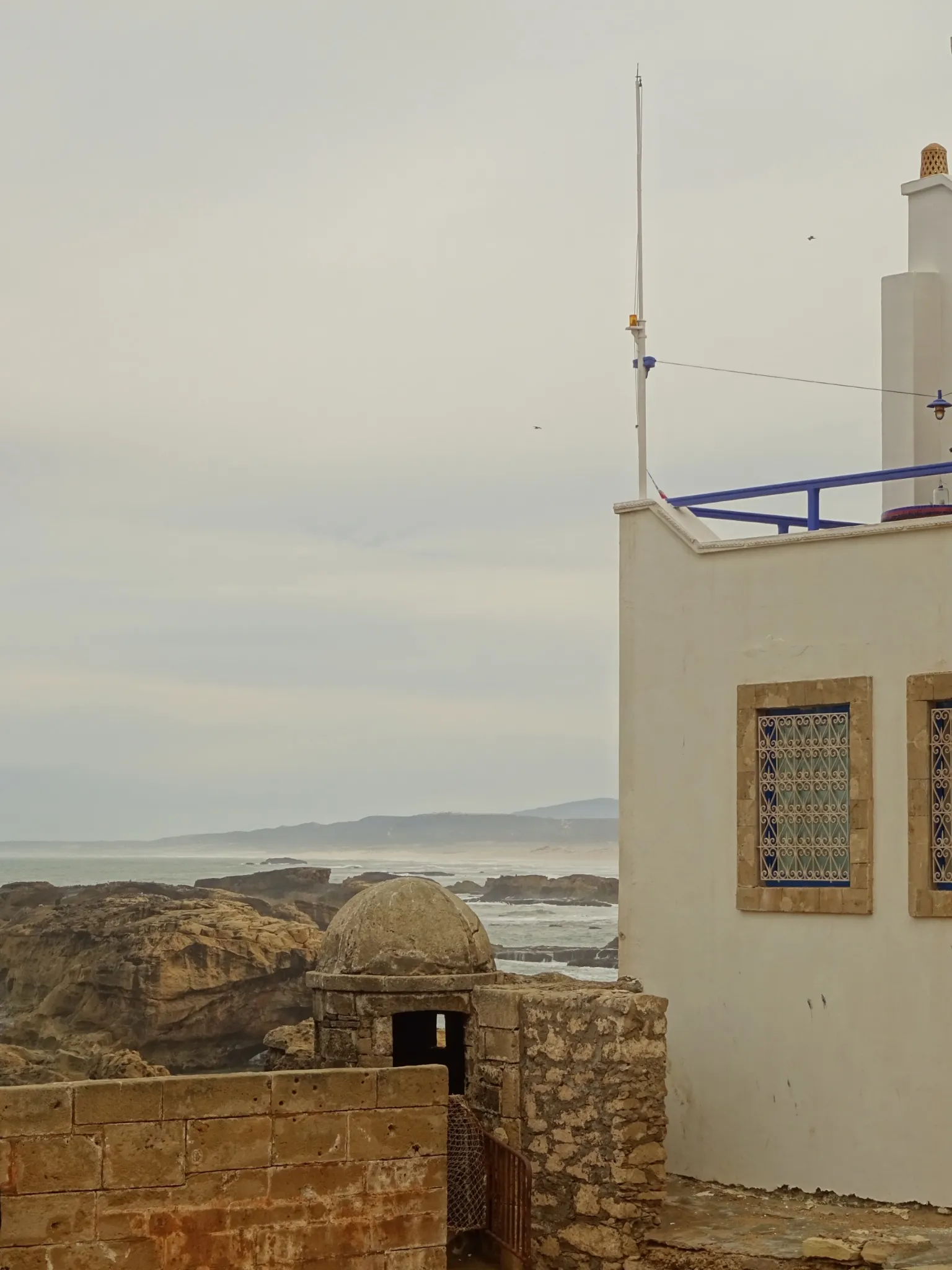 Essaouira beach with waves and sandy coastline
