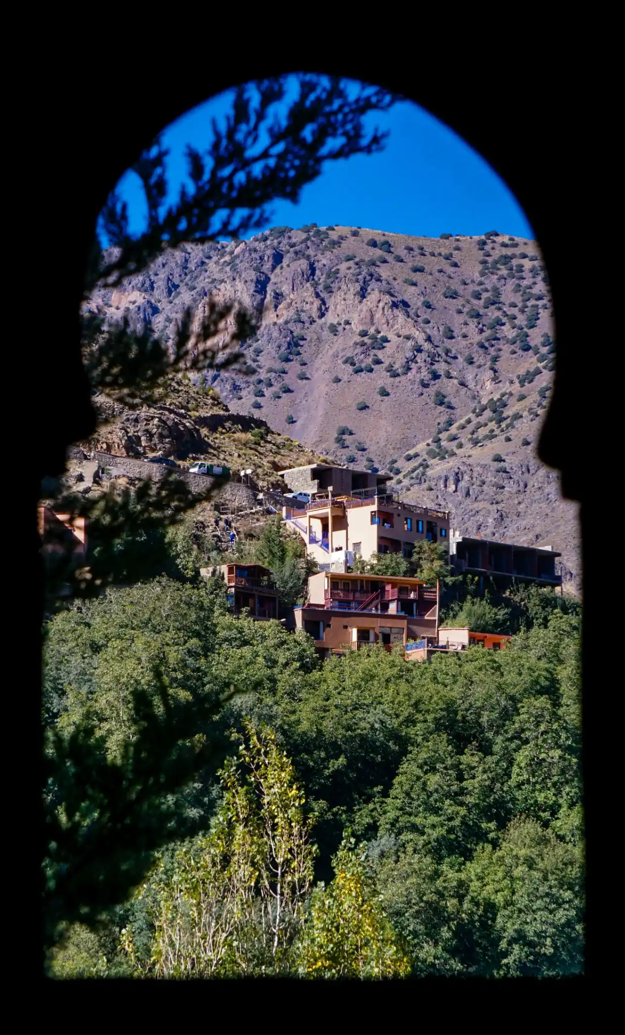 Panoramic view of snow-capped peaks surrounding the valley in Imlil Atlas Mountains.