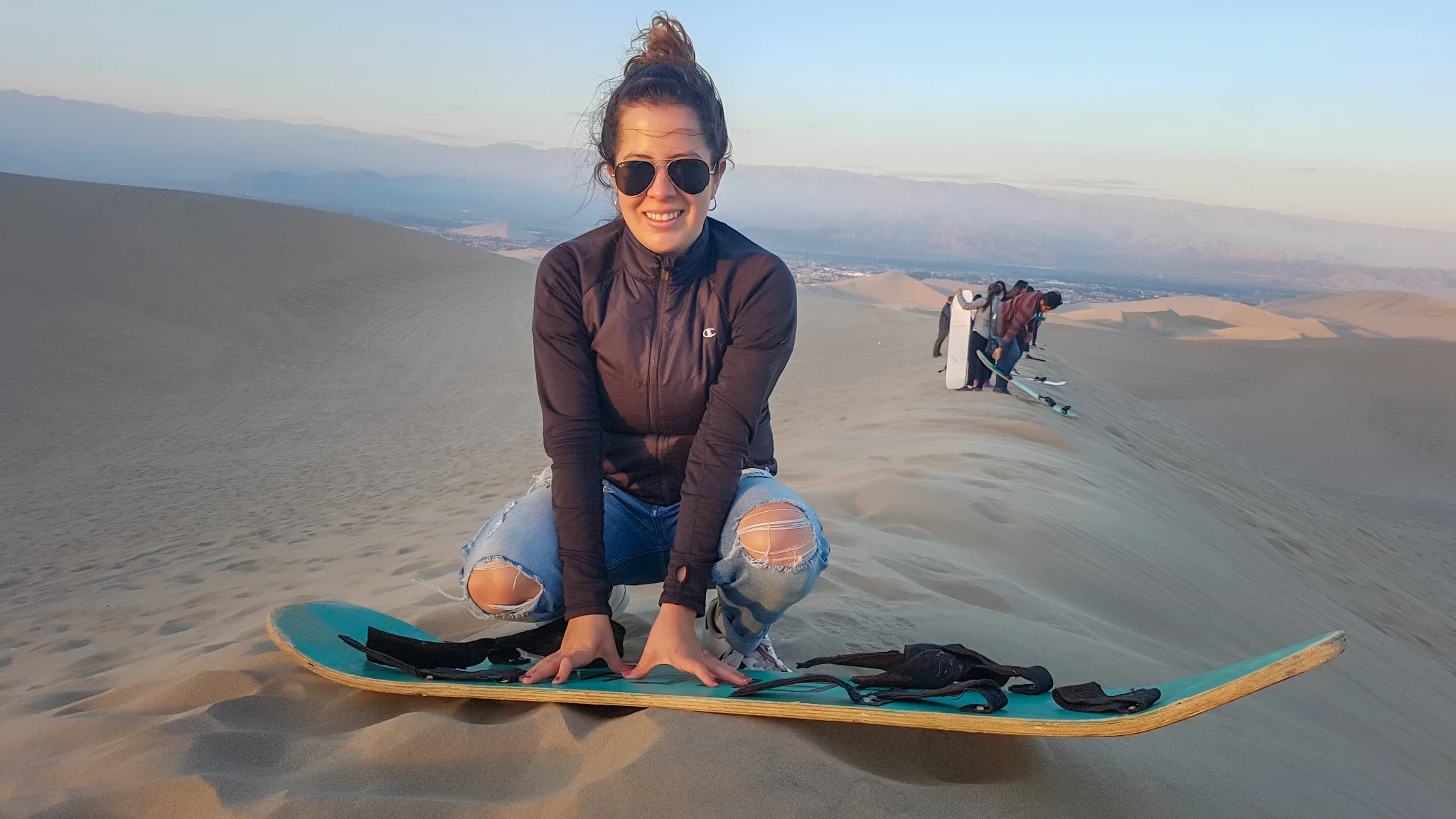 Sandboarding down the golden dunes of Erg Chebbi, Merzouga