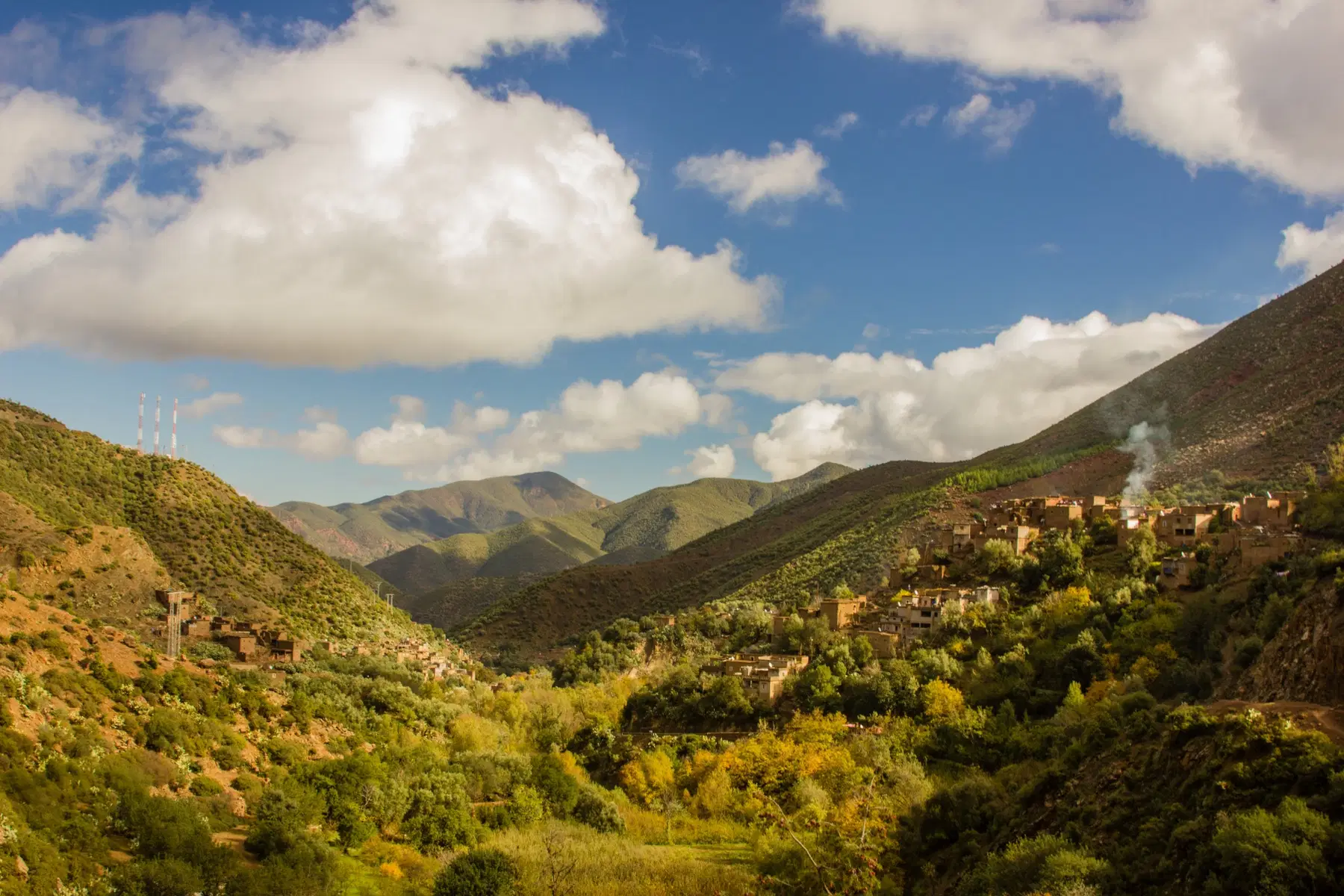Traditional Berber village with flat-roofed mudbrick houses nestled in Imlil Atlas Mountains.
