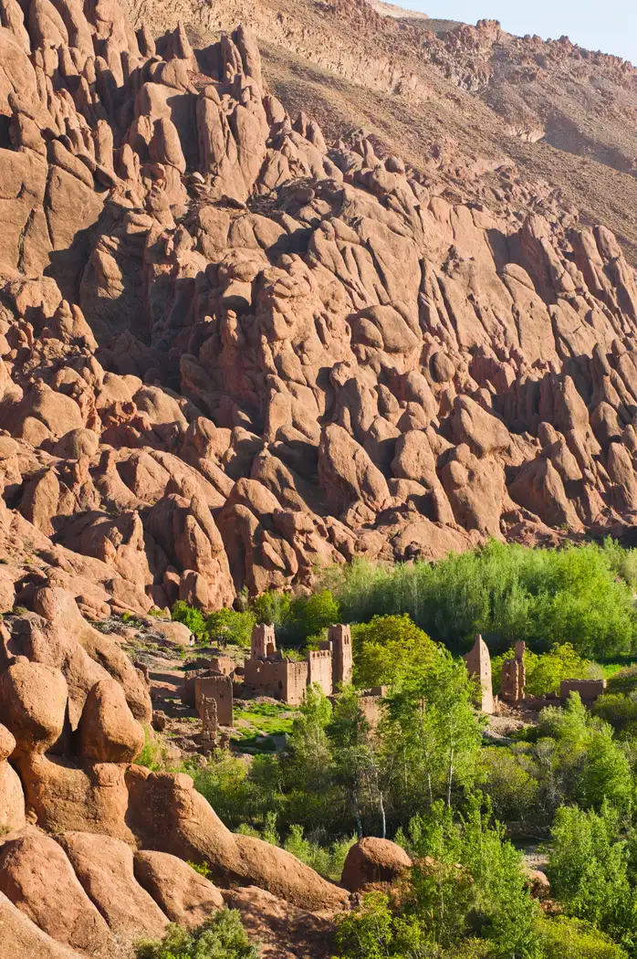 Travelers trekking through the Atlas Mountains in Morocco