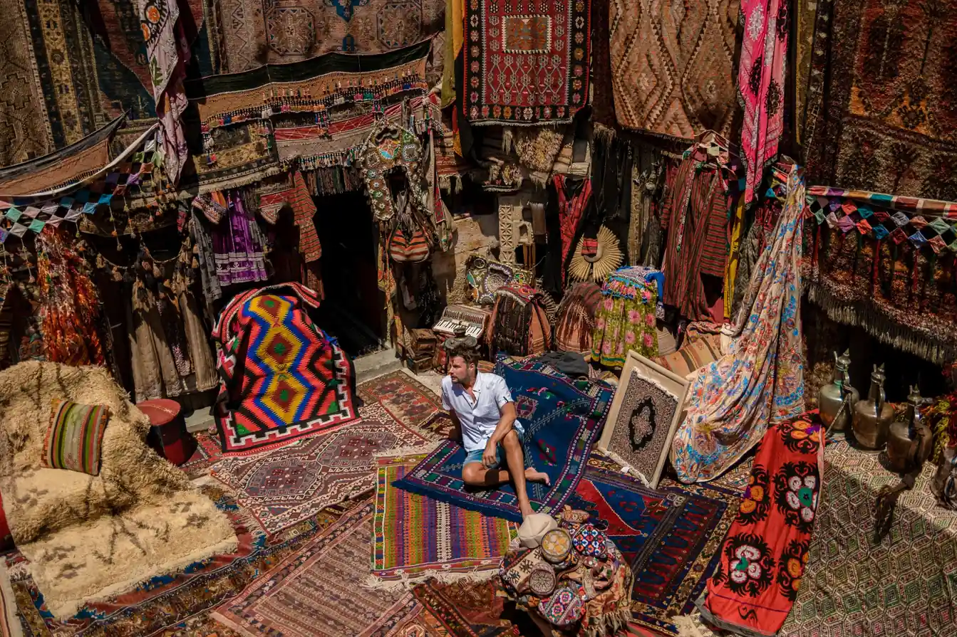 Workers dyeing leather in the colorful stone vats of Chouara Tannery on popular Fez tours.
