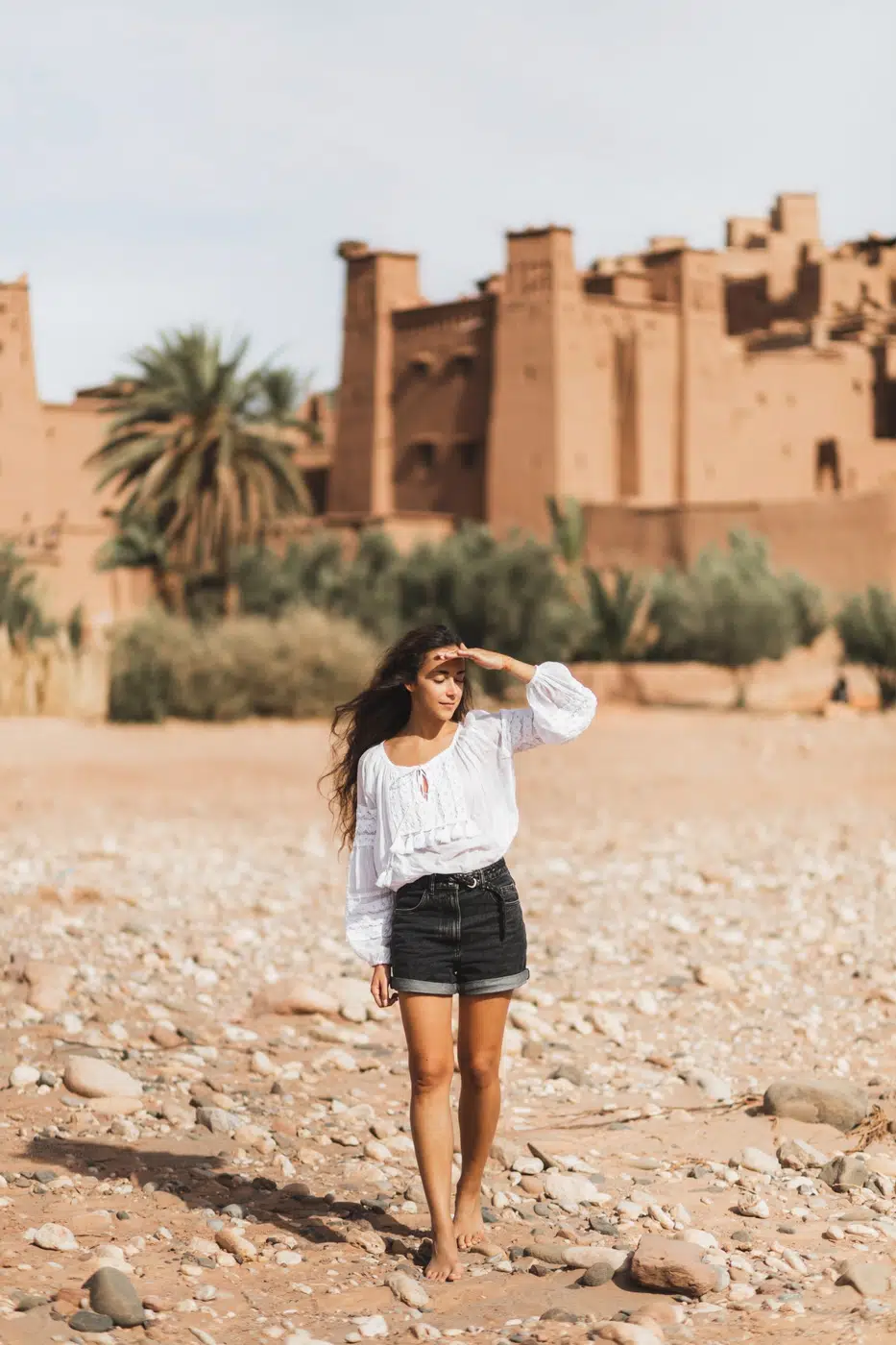 young-curly-woman exploring the historic Aït Benhaddou tour